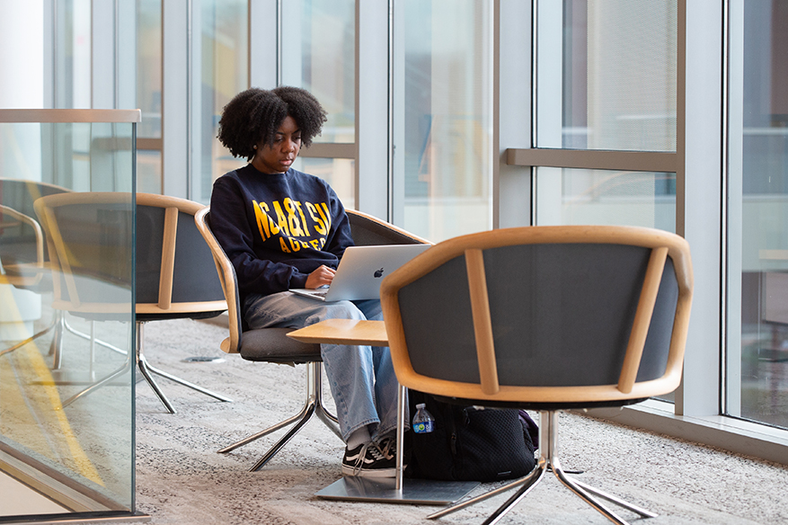 Female NCAT Student on laptop