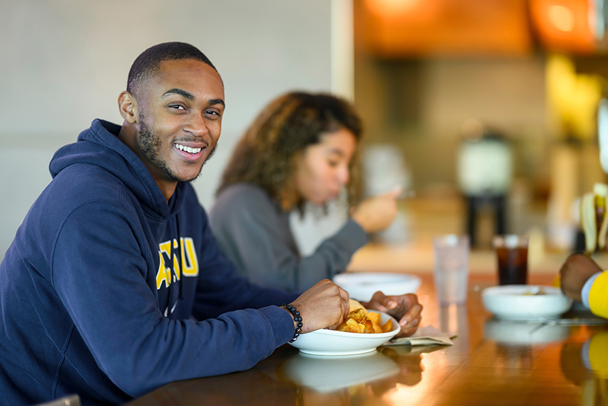 male NC A&T Student wearing a navy blue A&T Sweatshirt